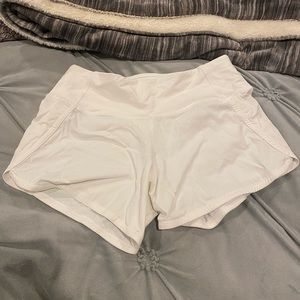 White lululemon shorts. 2.5” Size: 2